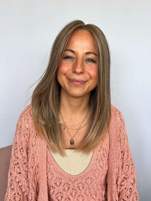 Kristin wearing SLEEK by ELLEN WILLE in color POWDER BLONDE TIPPED | Light Brown and Lightest Ash Blonde with Red Violet Blended with Pale Pink and Lighter Tipped Ends