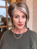 Jenny B. @thewiggygirl wearing REESE by NORIKO in color SANDY SILVER | Medium Brown Transitionally Blending to Silver and Dramatic Silver Bangs