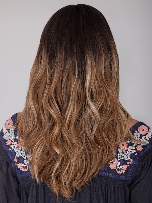 Roxie wearing BALAYAGE BEAUTY by RAQUEL WELCH in RL4/15OM | Dark brown blended roots that transition into a natural blonde ombré from midlength to the ends