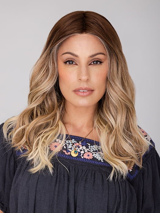 Roxie wearing BALAYAGE BEAUTY by RAQUEL WELCH in RL8/24OM | Medium brown blended roots that transition into a golden blonde ombré from midlength to the ends