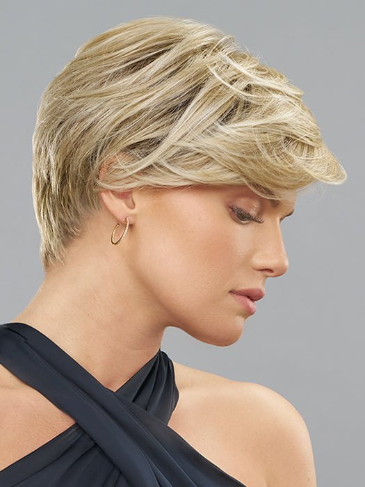 This style features textured layers and heavy-weight bangs