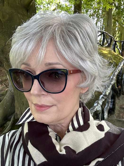 Mel B. @mels.be.ageless wearing VOLTAGE ELITE by RAQUEL WELCH WIGS in color RL51/61 ICED GRANITA | Lightest Grey Progresses to a Deep Grey at the Nape