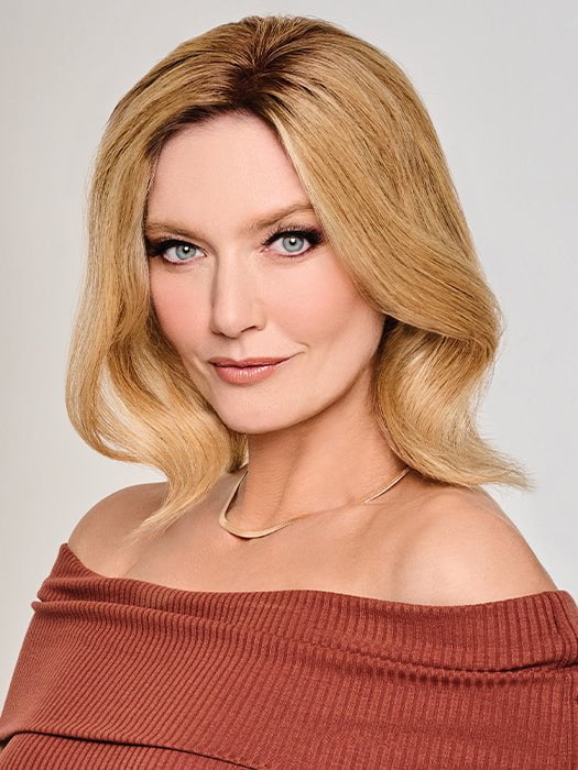 A Remy human hair topper with a reinforced thin edge and hand tied monofilament base for a seamless blend and “barely there” feel